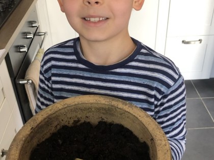 Luke from Peake class shows his seed we planted has started growing already & he enjoyed making his own sandwich and then writing the instructions!