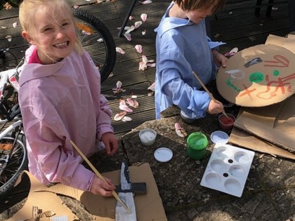 Olive and Corin made Viking shields and swords out of cardboard and then painted them.