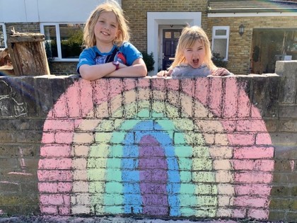 Indigo and Elowen supporting the NHS with their chalk rainbow.