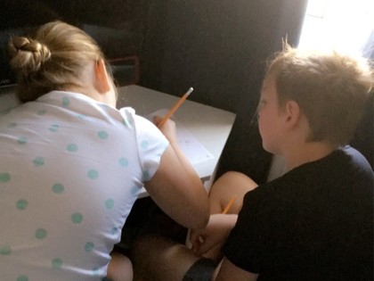Daisy was struggling with her maths so her big brother Charlie stepped in to help her understand and Lola is getting stuck into her writing task and looking forward to have a go at some science experiments later in the sunshine.