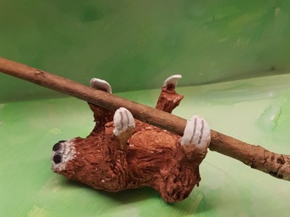 Ella made a sloth hanging from a branch from air drying clay. She used lots of pictures online as reference and made sure the stick fitted as she moulded. It took a few days to dry out properly but she was finally able to paint it today.