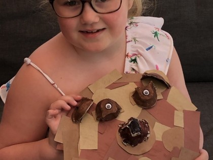 Elizabeth from Churchill class with a junk model grizzly bear she made as part of themed learning.