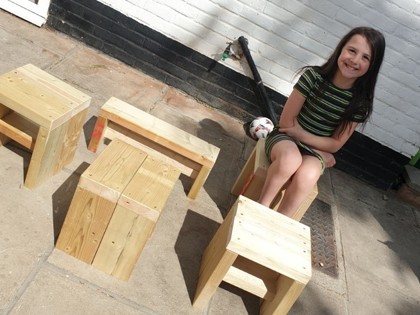 Charley from Churchill class has made the most of the lovely weather this weekend in the garden, helping to make wooden stools for the Library.